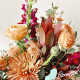 Fall flower arrangement by Bloomstall Flowers and Plants