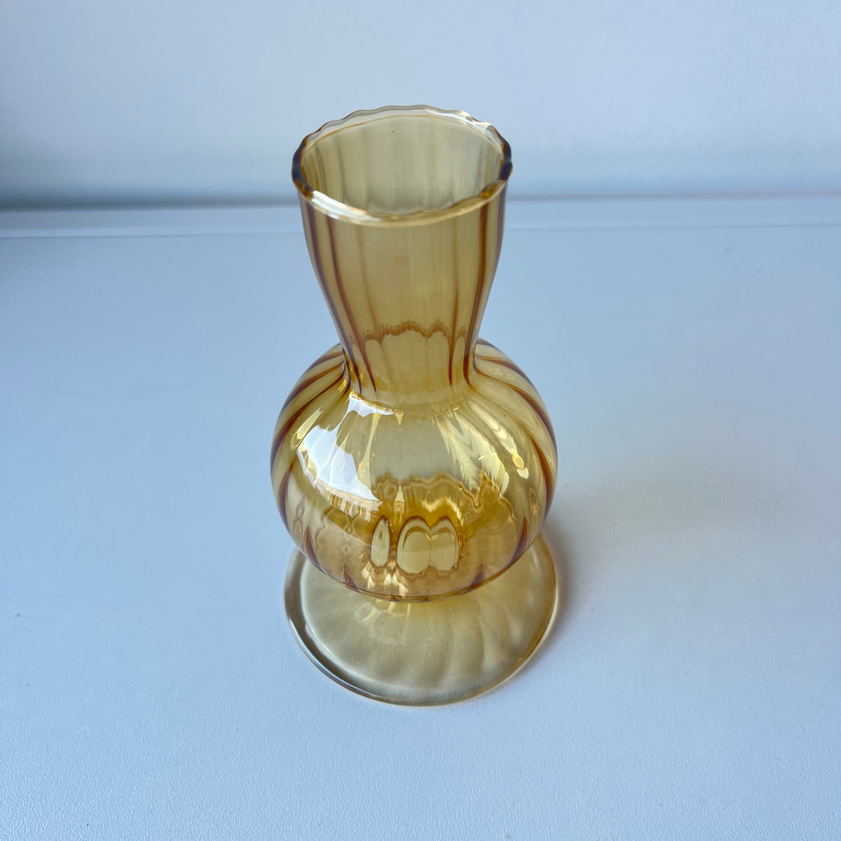 Delicate amber ribbed bud vase