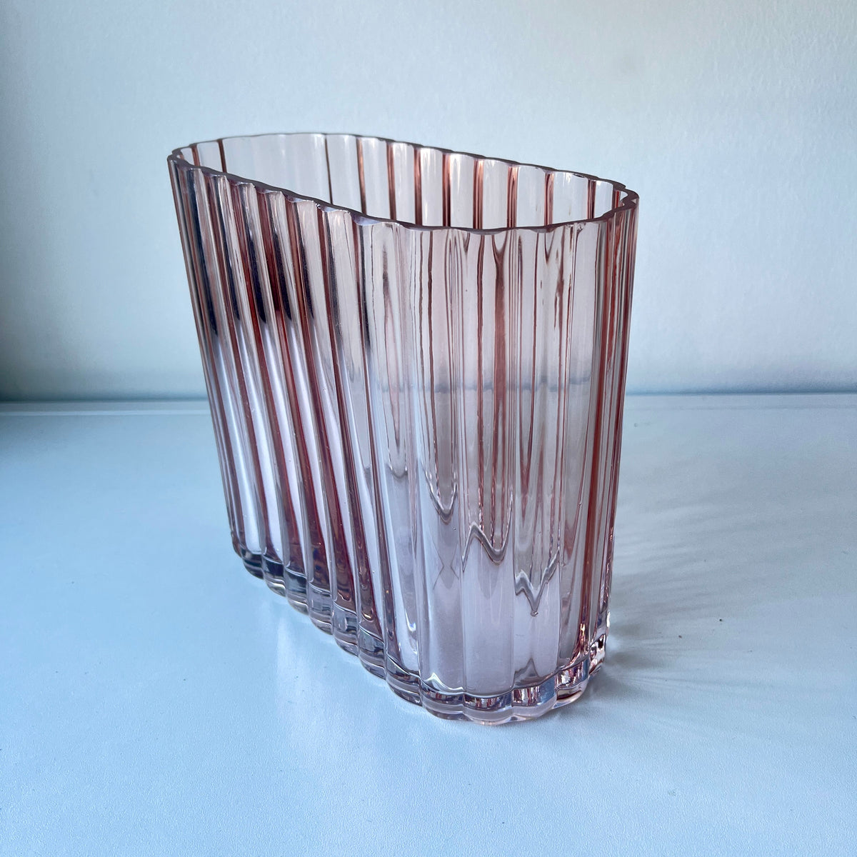 Blush color, heavy, ribbed art deco style vase.