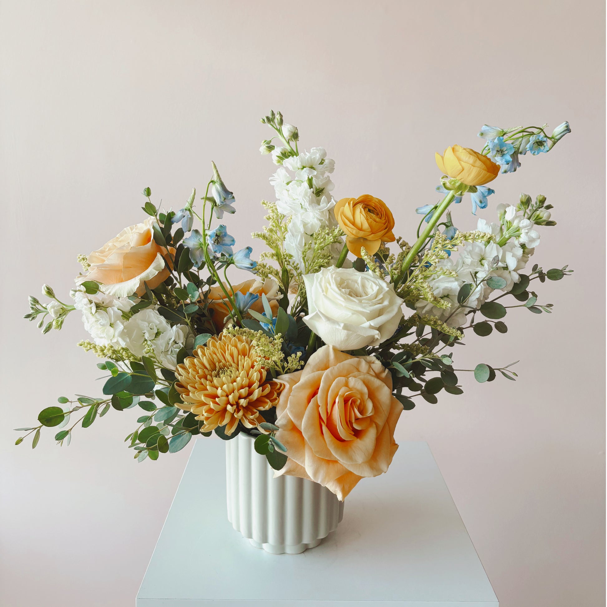 Bright and colorful sympathy flower arrangement 