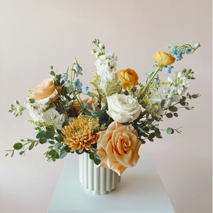 Bright and colorful sympathy flower arrangement 