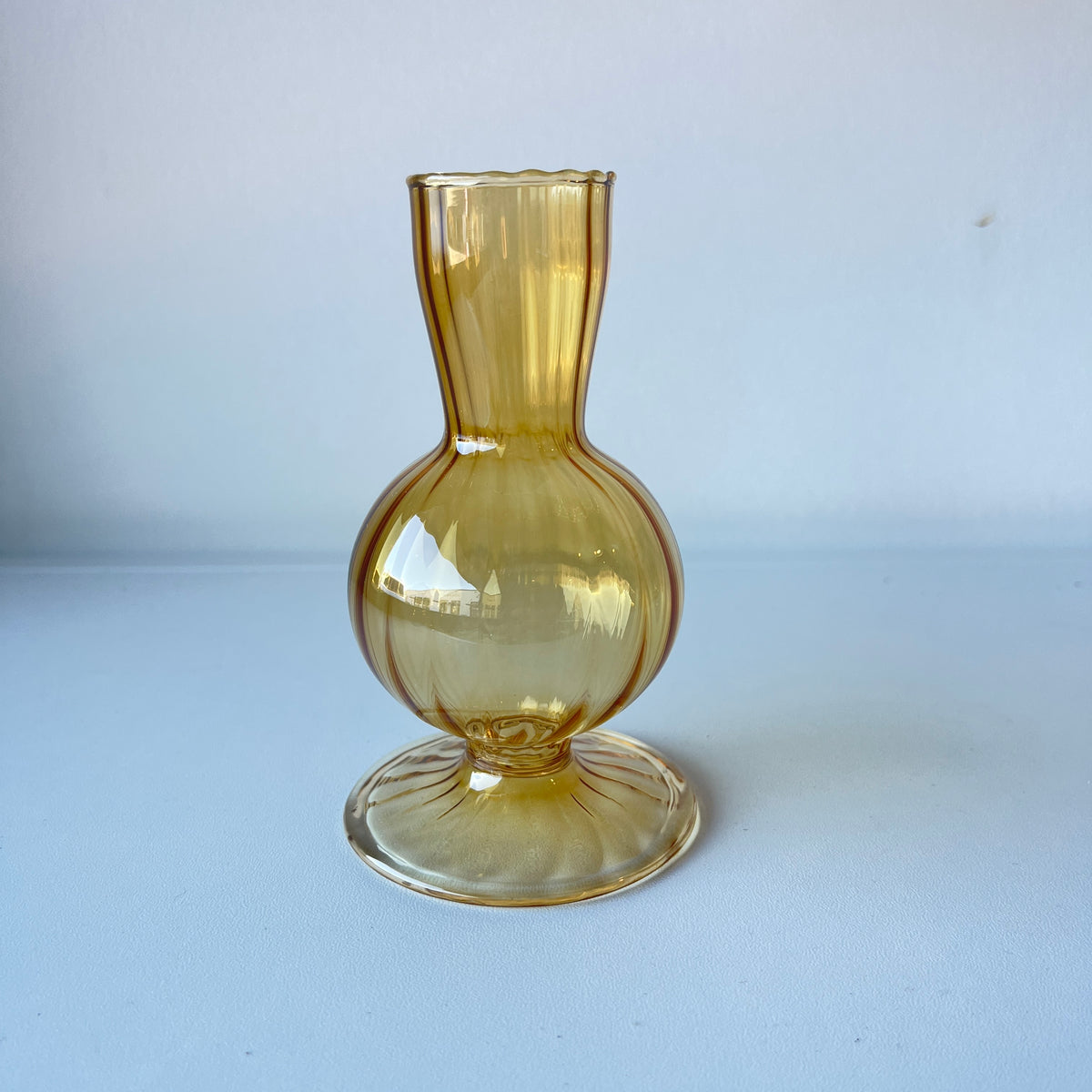 Delicate amber ribbed bud vase