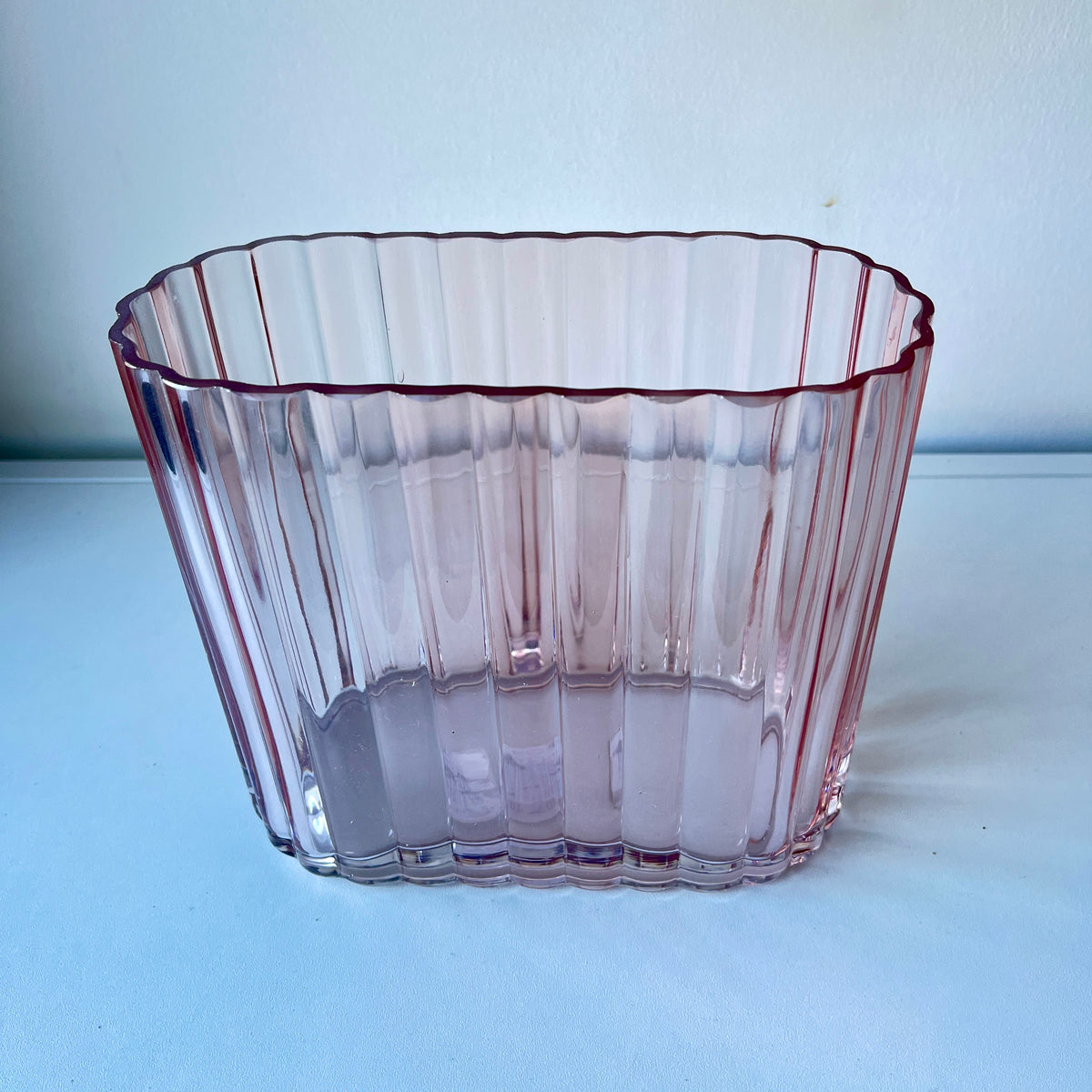 Blush color, heavy, ribbed art deco style vase.