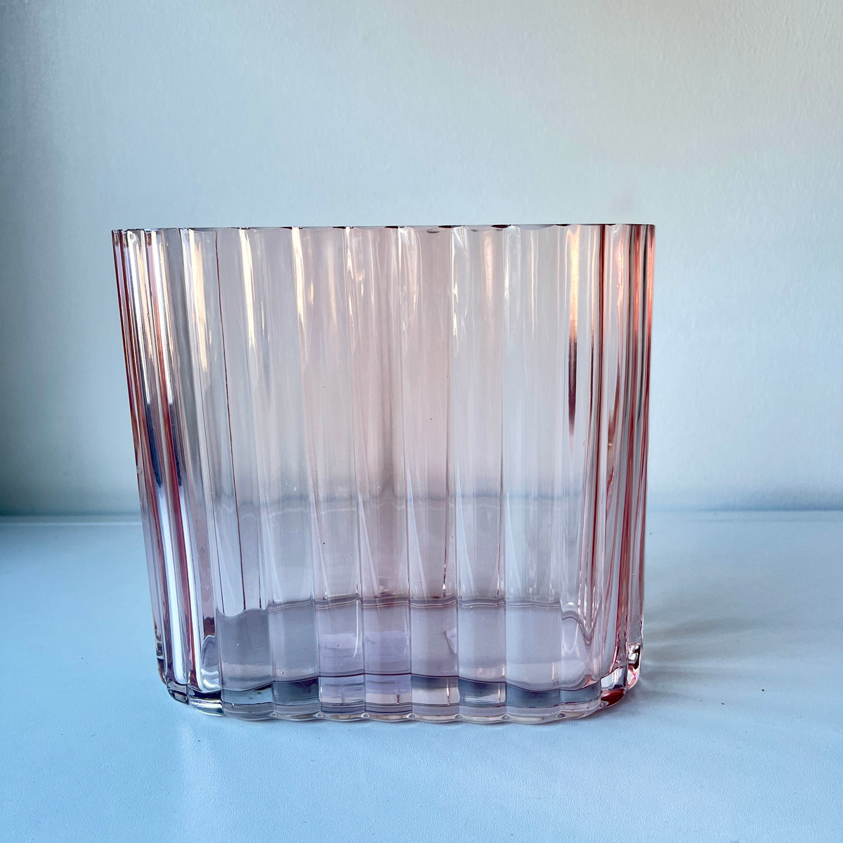 Blush color, heavy, ribbed art deco style vase.