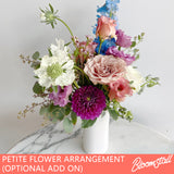 Add a petite flower arrangement to your gift box order.