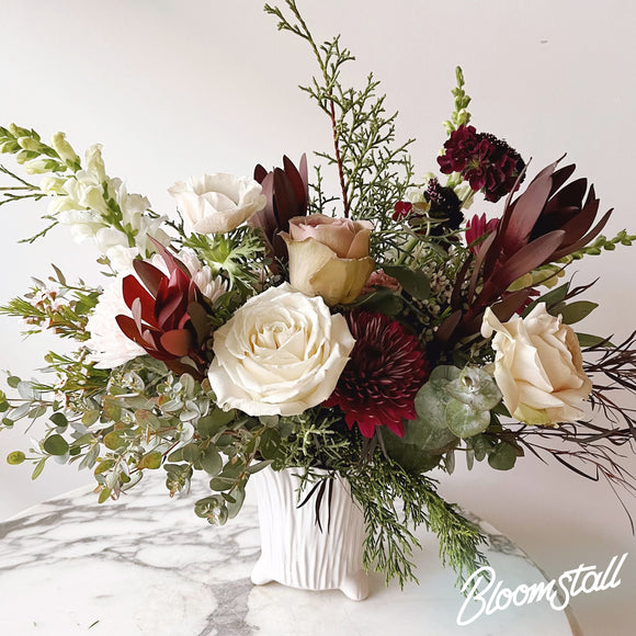 Black Forest holiday arrangement by Bloomstall Flower Shop in Columbia, Tennessee.