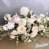 Beautiful white floral arrangement by Bloomstall Flowers.  Send flowers in Columbia, Tennessee with Bloomstall Florist.  Locally owned and operated.