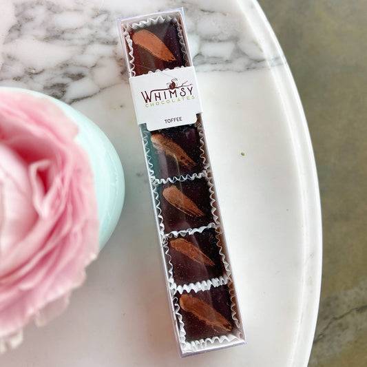 a package of 5 chocolates by Whimsy Chocolates, toffee flavored.